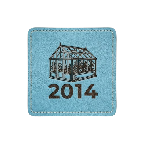 Light blue square patch with stitched border. Features a dark silhouette of a greenhouse and the text "2014."