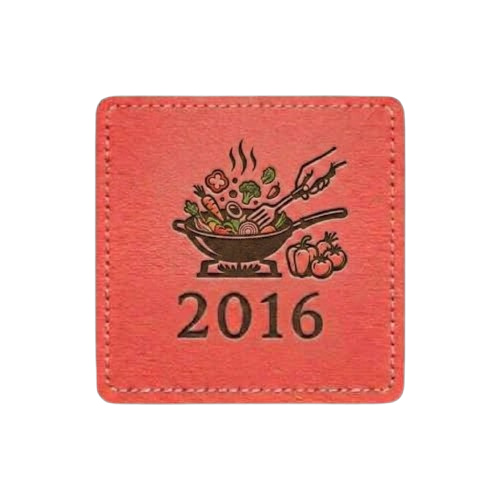 Red square patch with stitched border. Features a silhouette of a skillet cooking vegetables with the text "2016."