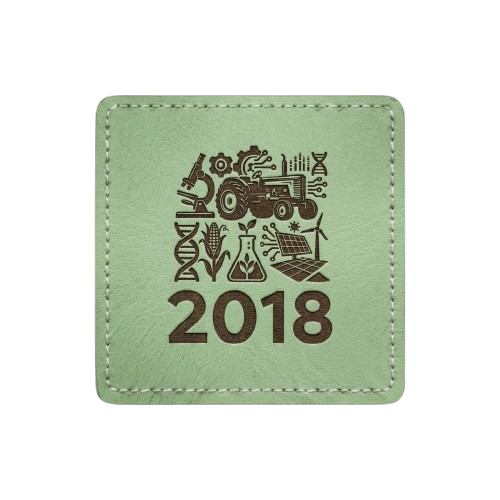 Light green square patch with stitched border. Features a silhouette of a tractor and various farm icons with the text "2018."
