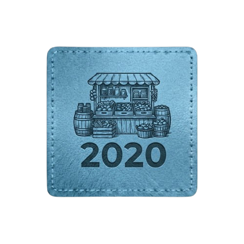 Light blue square patch with stitched border. Features a silhouette of a farm stand and the text "2020."