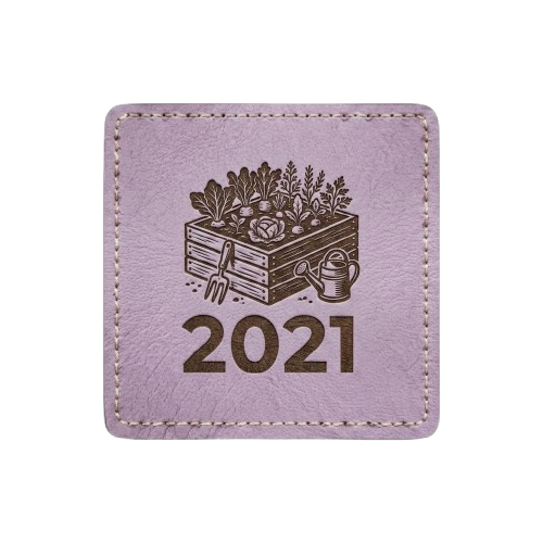 Light purple square patch with stitched border. Features an illustration of a wooden crate filled with vegetables and the text "2021."